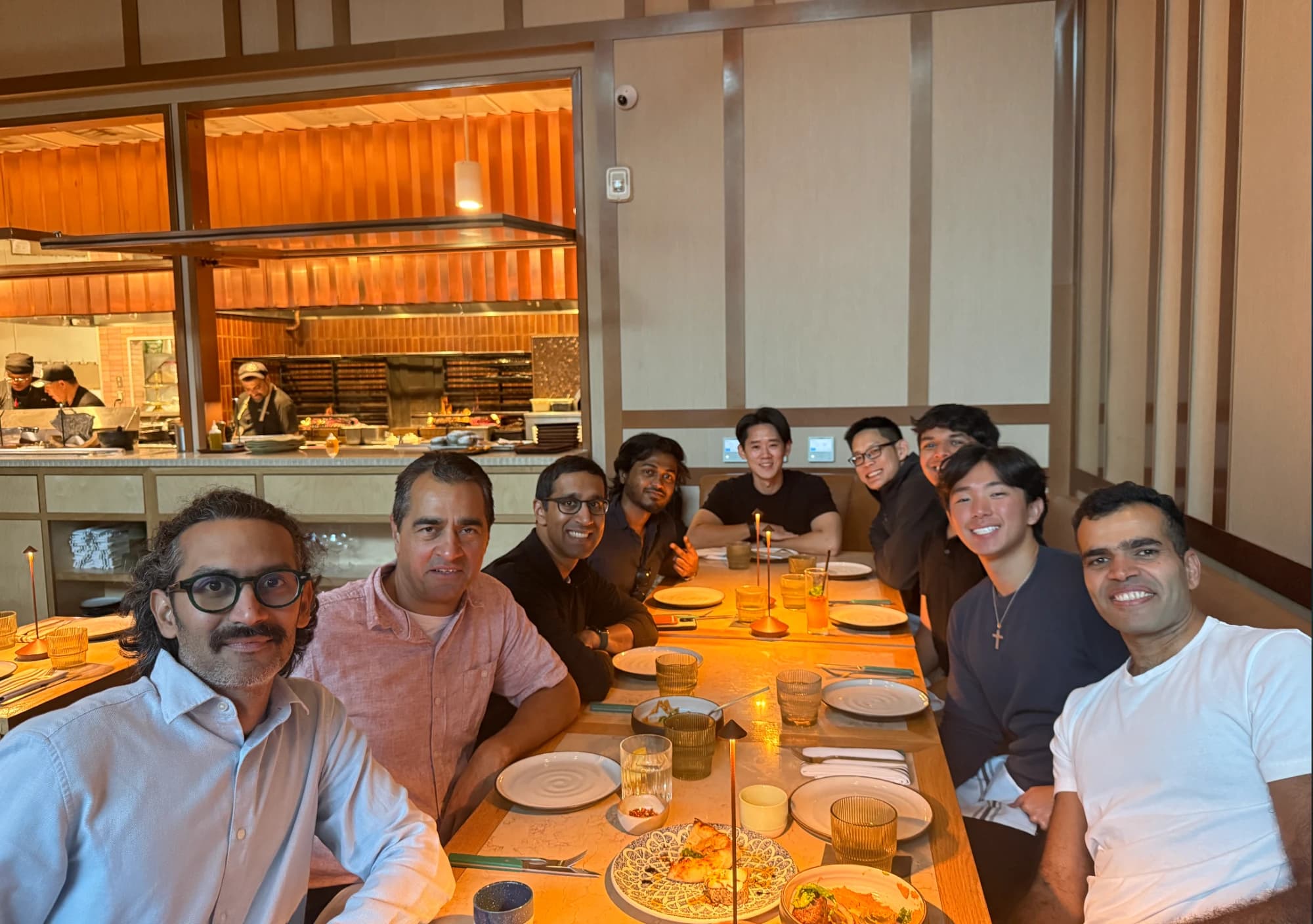 Team dinner around a long restaurant table