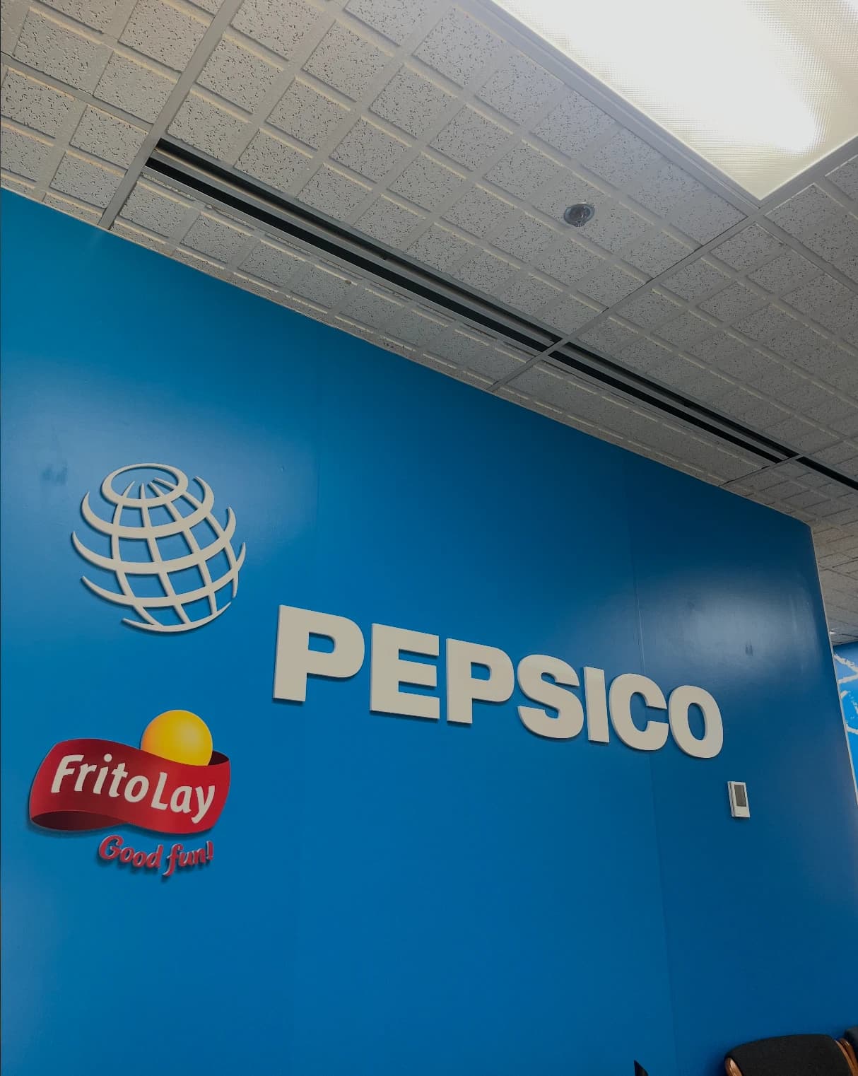 PepsiCo and Frito-Lay sign on an office wall