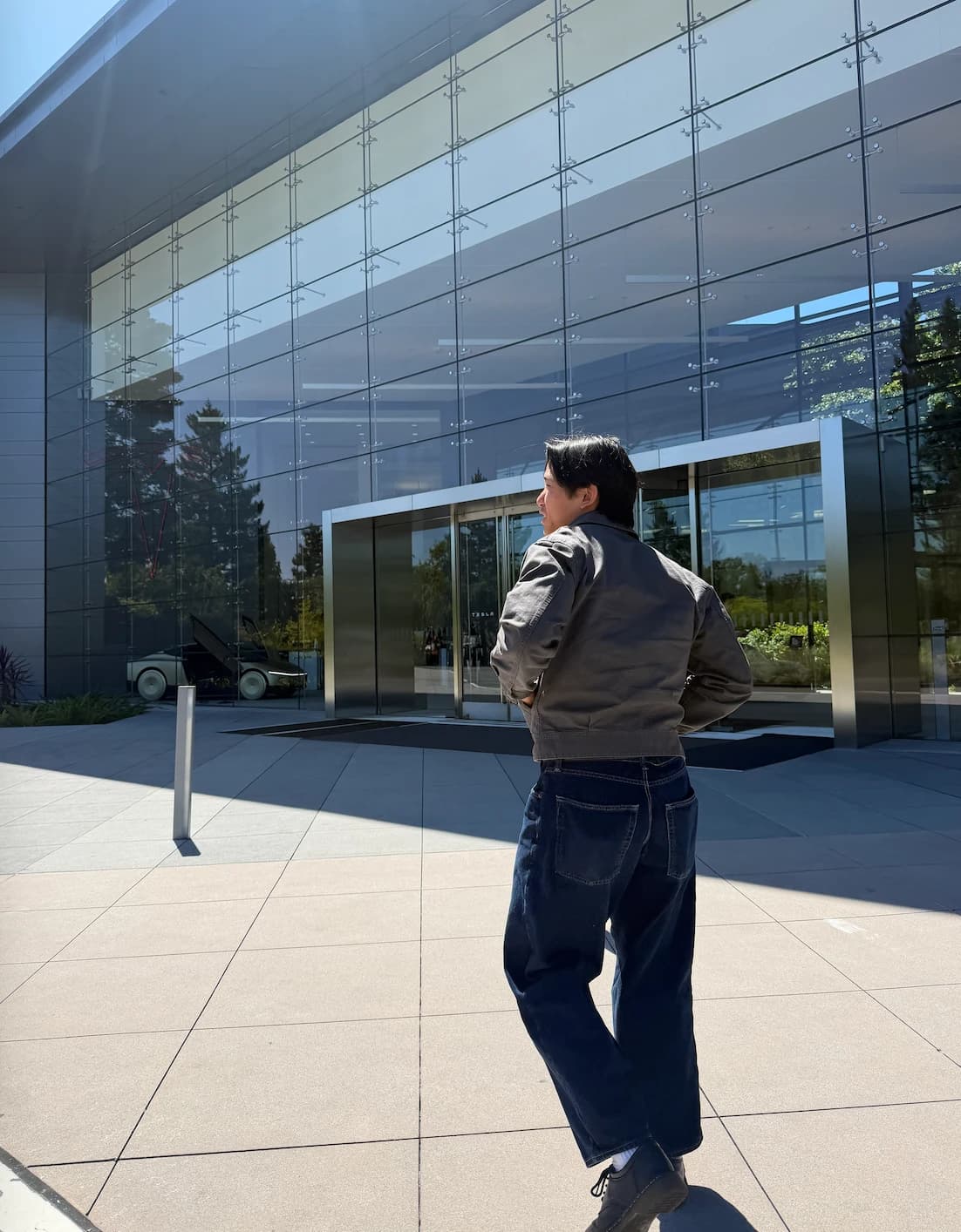 Ryan walking toward the Tesla building